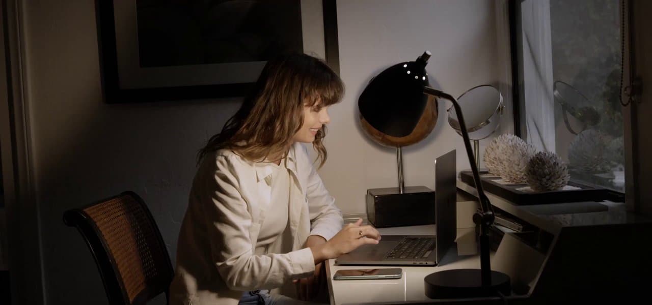 A professional woman on a laptop video call, representing interview preparation and remote screening.